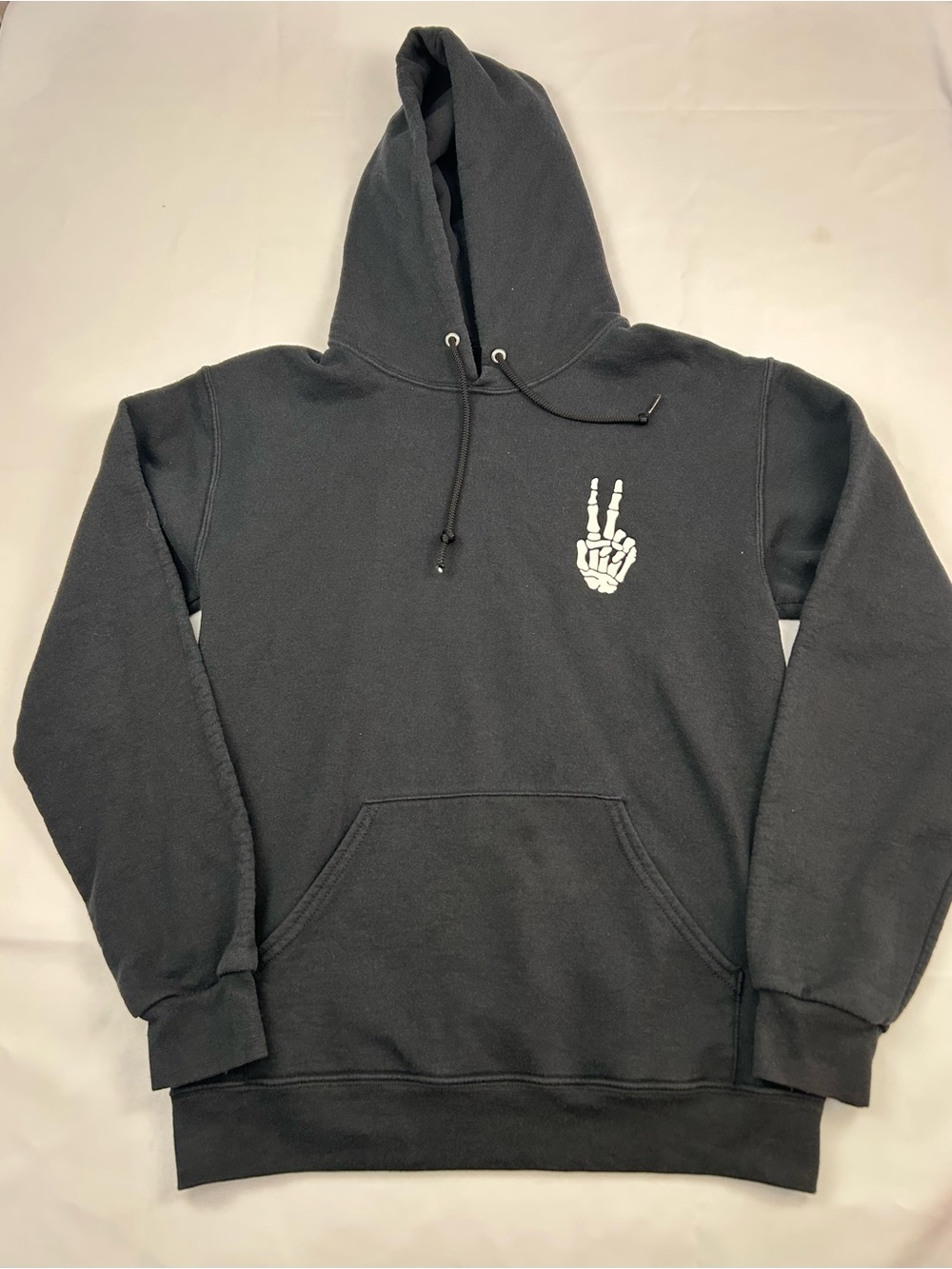 Black Men's Pullover Hoodie with White Skeleton Peace Hand Graphic